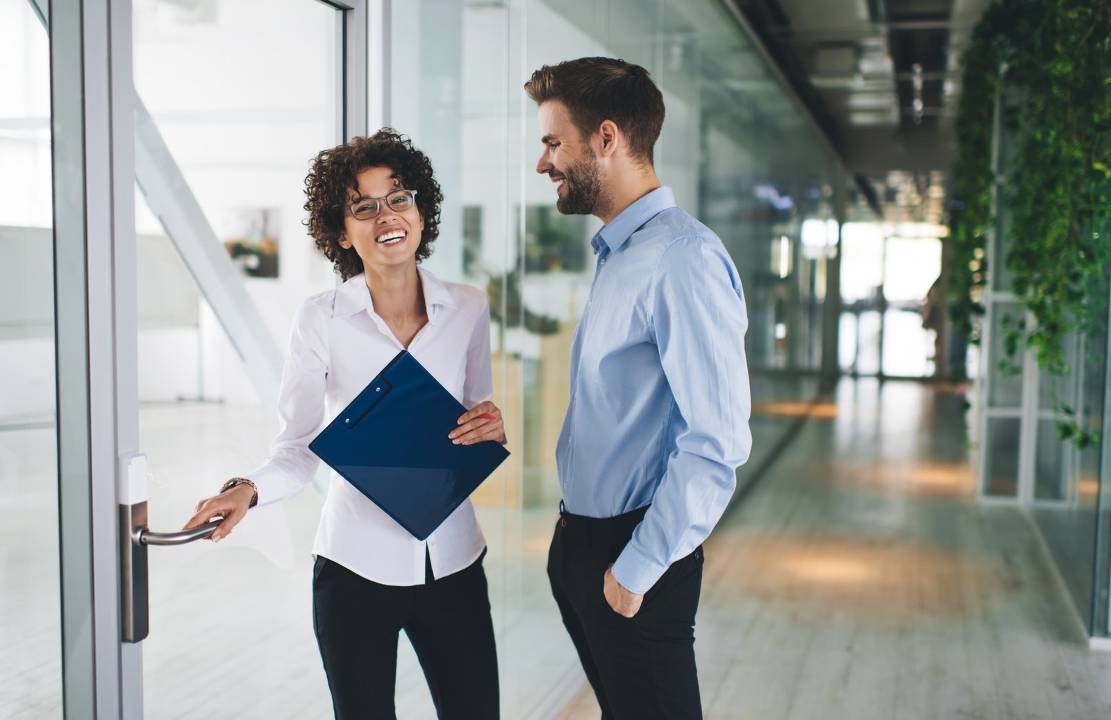 Millenial business man and woman working in office